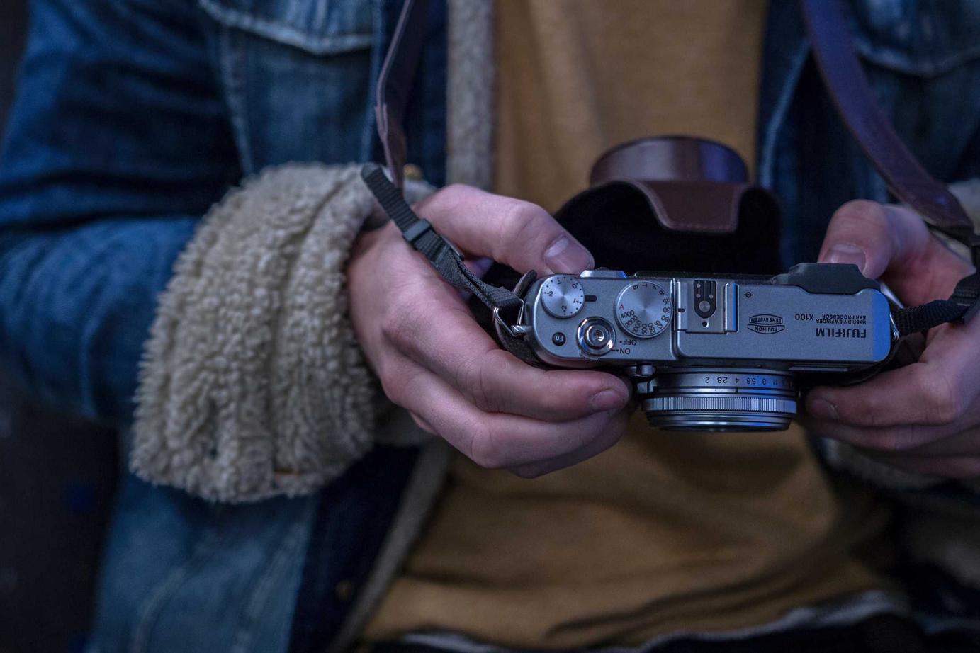 A person holding a film camera