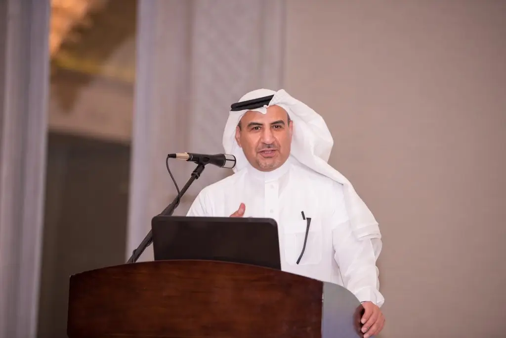 Speaker addressing the audience from the podium at the DGS dinner meeting with the Ma'aden CEO