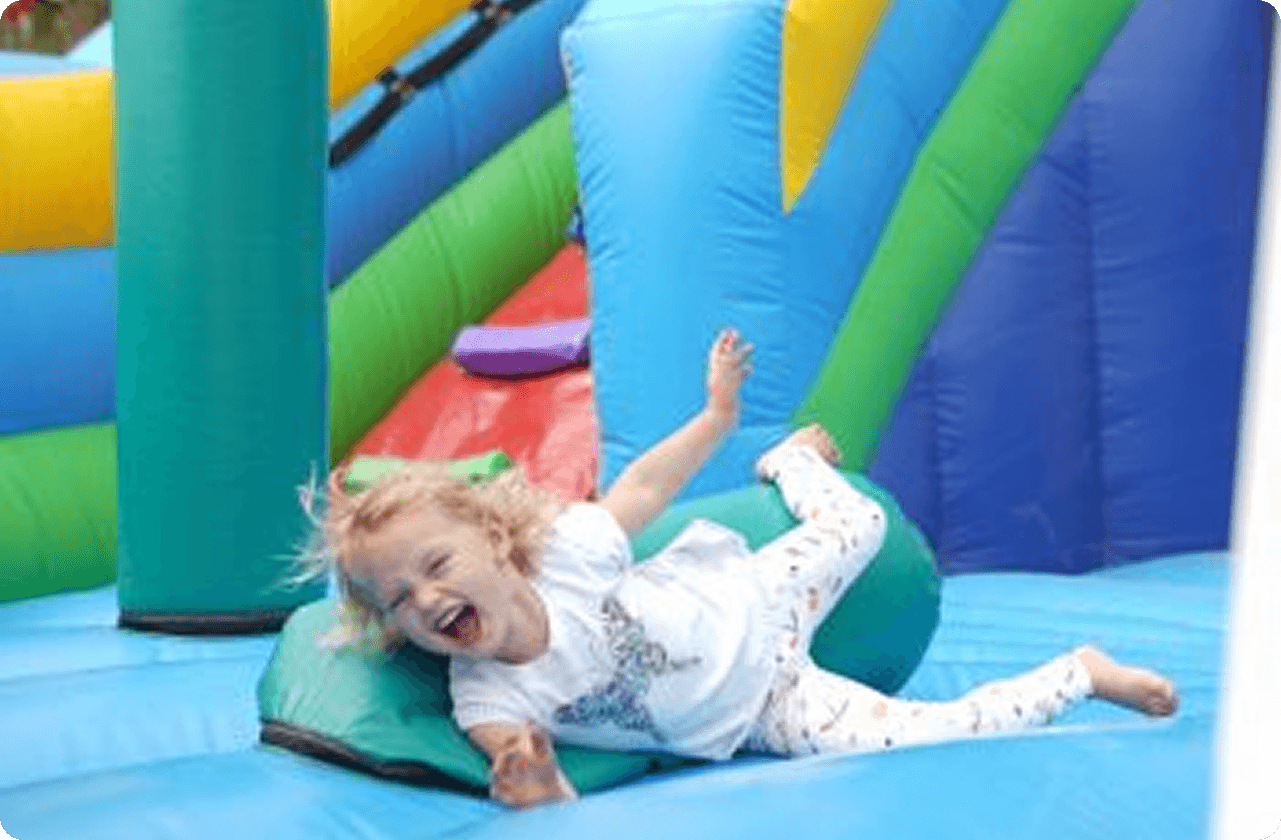 A child playing on a bouncy castle at the DGS Family Festival 2019