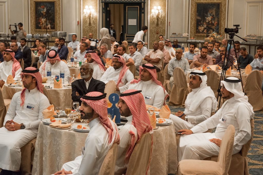 Guests seated at tables during a DGS dinner meeting