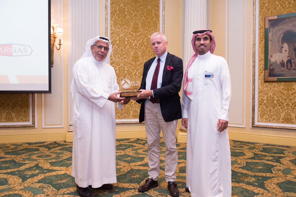A guest receiving an award at a DGS dinner meeting