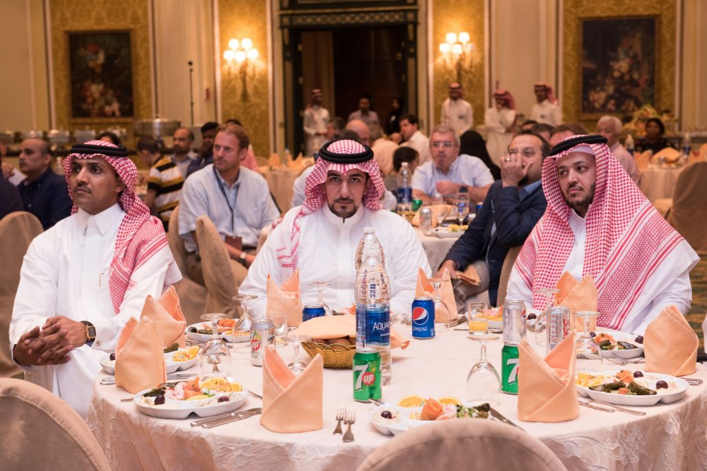 Guests talking around a dinner table at a DGS event
