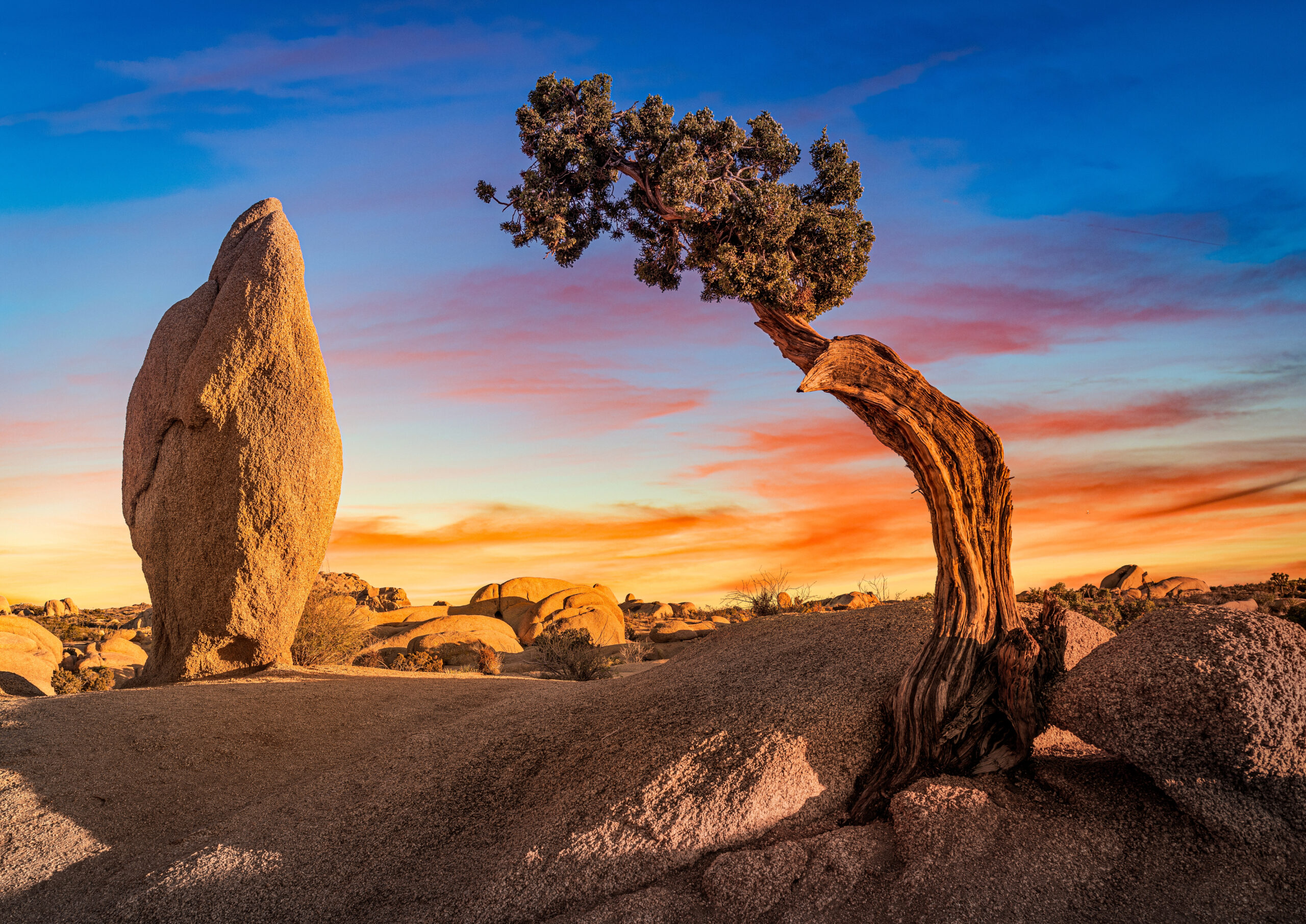 Rock formations at sunset, illustrating an article on geothermal exploration